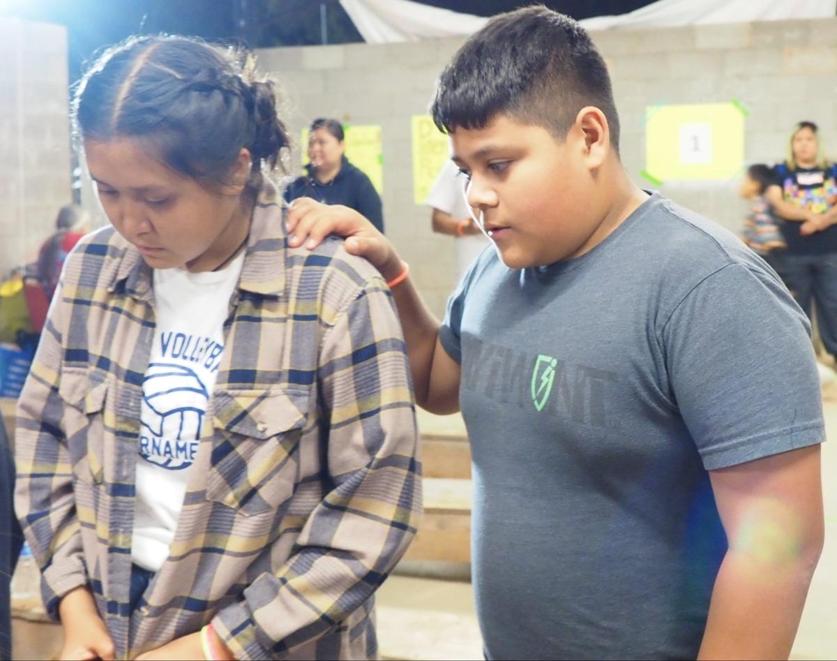 Praying together on a missions trip